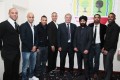 Sir Trevor Brooking, centre right, and Mr Ryan DeCosta, second right, with players of Southall FC
