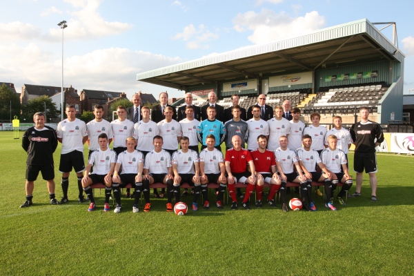 Back Row(L-R): Geoff Maddock, Richard Cross (Secretary), Paul Leary (Chairman), Peter McCormack, Maurice Broderick (Treasurer), Paul Eustace, Barry Godfrey
Middle Row(L-R): Gary Trowler (Kit Manager), Robbie Lawton, Liam Dawson, Alan Burton, Paul Lundon, John Shaw, Liam Duff, Ryan McMahon, Callum Williams, Matty Brown, Danny Grannon, Jonathan Goulding, Nick Rogan, Andy Fowler, Nick McCarthy (Sports Therapist)
Front Row (L-R): Matty Devine, Michael Ordish, Karl Noon, Shaun Dowling, Tony Sayer, Kevin Lynch (Manager), Phil Brazier (Assistant Manager), Liam Rice, Thomas Moore, Marcus Carver
Photos by kind permission of Ray Farley Photography. Back Row(L-R): Geoff Maddock, Richard Cross (Secretary), Paul Leary (Chairman), Peter McCormack, Maurice Broderick (Treasurer), Paul Eustace, Barry Godfrey
Middle Row(L-R): Gary Trowler (Kit Manager), Robbie Lawton, Liam Dawson, Alan Burton, Paul Lundon, John Shaw, Liam Duff, Ryan McMahon, Callum Williams, Matty Brown, Danny Grannon, Jonathan Goulding, Nick Rogan, Andy Fowler, Nick McCarthy (Sports Therapist)
Front Row (L-R): Matty Devine, Michael Ordish, Karl Noon, Shaun Dowling, Tony Sayer, Kevin Lynch (Manager), Phil Brazier (Assistant Manager), Liam Rice, Thomas Moore, Marcus Carver
Photos by kind permission of Ray Farley Photography.